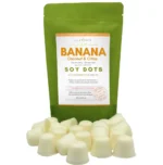 Banana Coconut Citrus wax melt dots displayed in front of a rice paper stand-up pouch from Lux Candles & Melts.