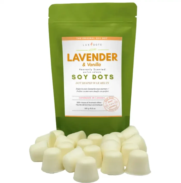 Lavender Vanilla wax melt dots displayed in front of a rice paper stand-up pouch from Lux Candles & Melts.