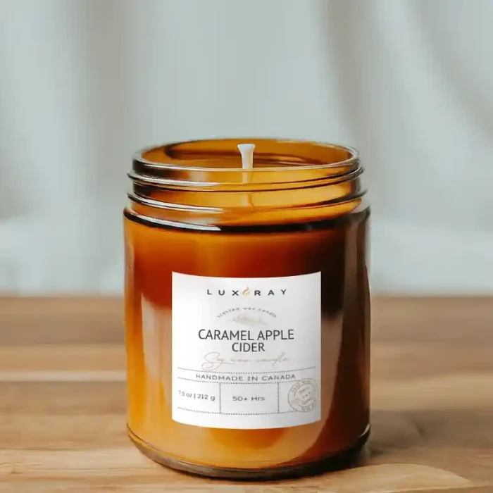 Caramel Apple Cider Amber Jar Soy Candle by Lux Candles & Melts, radiating a cozy blend of caramel sweetness and crisp apple cider.